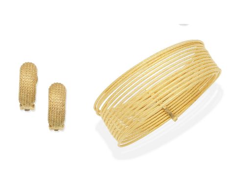 A bangle, by UnoAErre, and a pair of earclips, by Grossé1st: Designed as a sprung textured coil, 2nd: Each curved plaque of t