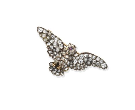 A ruby and diamond brooch, circa 1890Designed as an owl in mid-flight, the wings and body set throughout with rose-cut diamon