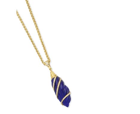 A lapis lazuli and diamond pendantThe carved lapis lazuli drop accented by courses of brilliant-cut diamonds, to a simiarly-c