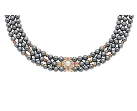 A cultured pearl, ruby, diamond and hematite bead necklaceThe three strands of 7.0mm hematite beads interspersed by step-cut 