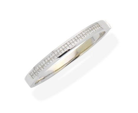 A diamond bangleChannel-set to the front with two rows of princess-cut diamonds, diamonds approx. 2.45cts total, inner measur