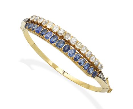 A late 19th century sapphire and diamond bangleThe front set with two detachable rows of cushion-shaped sapphires and similar