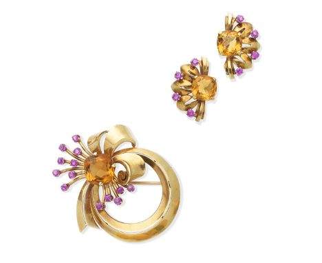 A ruby and citrine brooch and earclip suite, by Tiffany, circa 1940The stylised ribbon and floral spray set with a cushion-sh
