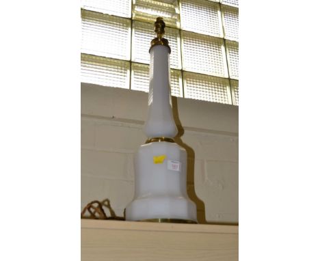 A milk glass lamp, of mallet form with brass mounts
