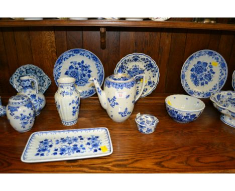 A collection of 20th century Dutch Delft, including moon flask, vases, plates, chambersticks, and other items