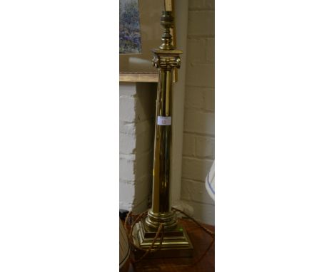 A brass Doric column table lamp, with pleated shade