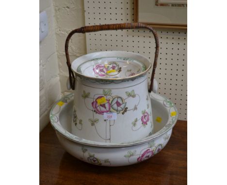 A late 19th century wash basin and lidded pail, each decorated with stylised roses