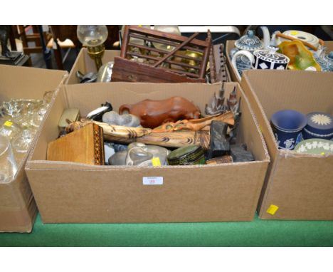 A box of 20th century ethnographia, including carved wood animals, boxes, bone figures, reproduction netsuke and other items