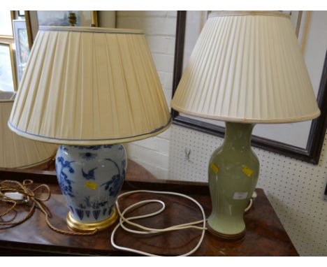 A 20th century Chinese blue and white baluster vase table lamp, and another celadon glazed lamp, each with pleated shade