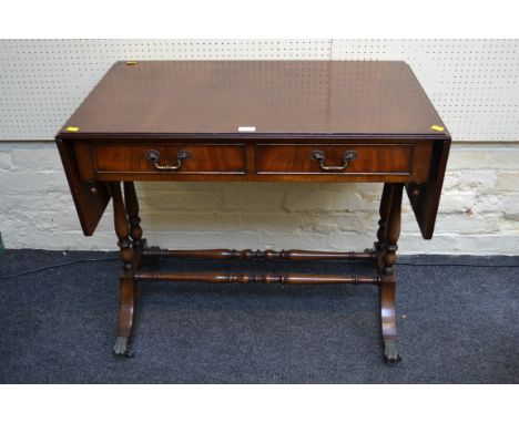 A good quality reproduction mahogany sofa table