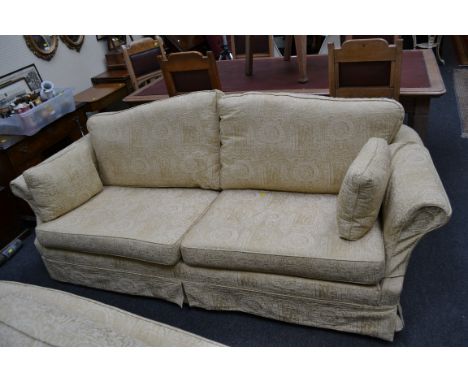 A modern two seat sofa with arched back