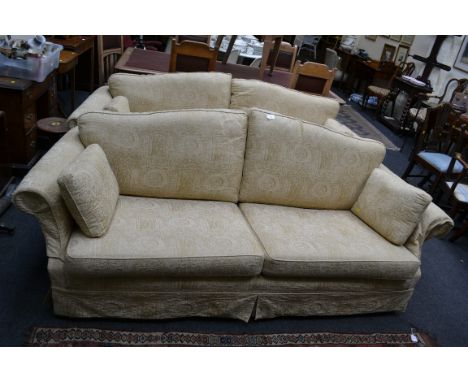 A modern two seat sofa with arched back