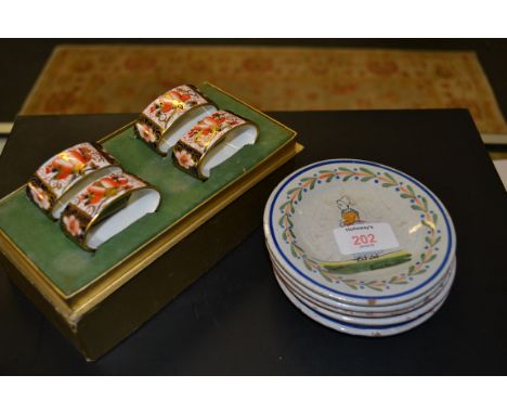 A small collection of five P.B. marked quimper, circular faience pin dishes painted with Breton figures, together with a boxe