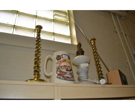 A pair of large brass barley twist candlesticks, a reproduction Henley Ales jug and an alabaster paraffin lamp converted for 
