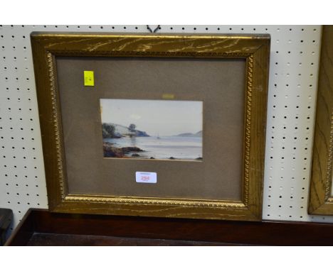 R. P?, A moored yacht in an estuary, watercolour, indistinctly monogrammed, in gilt oak frame, 11 x 18cm