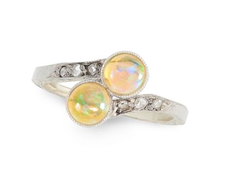 AN ANTIQUE OPAL AND DIAMOND DRESS RING the twisted shank terminated by two round cabochon opals, accented by rose cut diamond