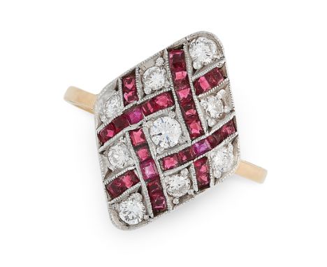 A RUBY AND DIAMOND DRESS RING in 18ct yellow and white gold, the diamond shaped face set with woven overlapping rows of step 