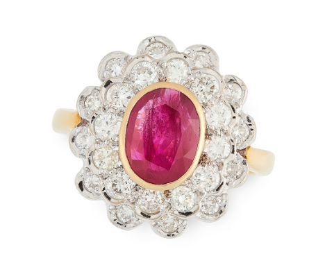 A RUBY AND DIAMOND CLUSTER RING in 18ct yellow gold, set with an oval cut ruby of 1.50 carats within a two row border of roun