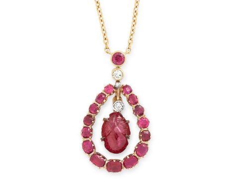 A RUBY AND DIAMOND PENDANT NECKLACE in yellow gold, set with a central Mughal carved ruby of foliate design, suspended within