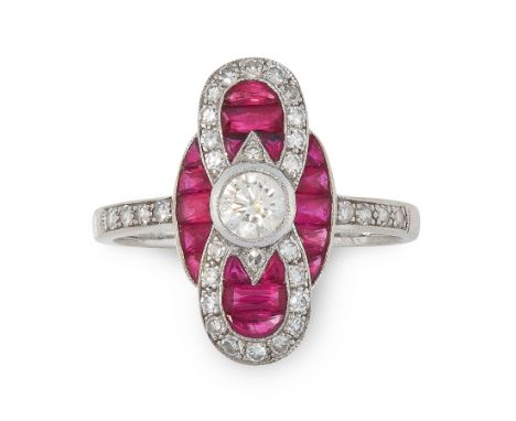 A RUBY AND DIAMOND RING in 18ct white gold, in Art Deco design set with a central round cut diamond accented by calibre cut r