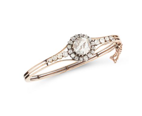 AN ANTIQUE DIAMOND BANGLE, 19TH CENTURY in high carat yellow gold, the trifurcated body set with a central rose cut diamond o