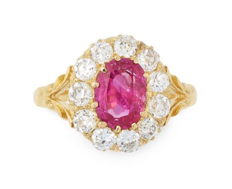 AN ANTIQUE BURMA NO HEAT RUBY AND DIAMOND RING in 18ct yellow gold, set with an oval cut ruby of 1.50 carats, within a border