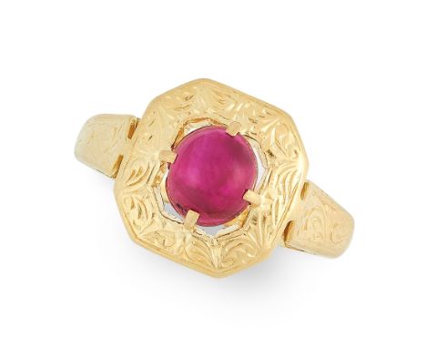 A RUBY DRESS RING in high carat yellow gold, set with an oval cabochon ruby of 1.9 carats, within an octagonal border with en