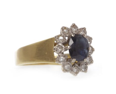 EIGHTEEN CARAT GOLD SAPPHIRE AND DIAMOND CLUSTER RING
set with a central oval sapphire surrounded by round diamonds, on a bro