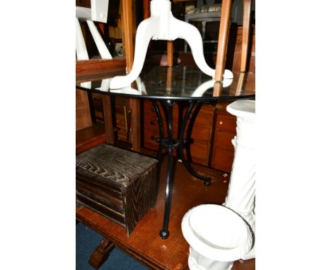 A CIRCULAR GLASS TOPPED TABLE on a seperate wrought iron base, diameter 96cm, together with a painted tripod table, gilt fram