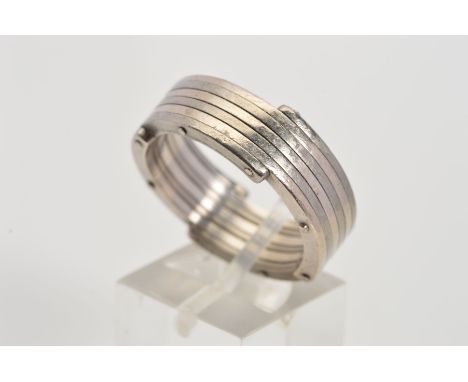 A BI-METAL GENTLEMAN'S RING, designed as a tight coil of alternate metals, the layered edges with rivet style detail, assesse