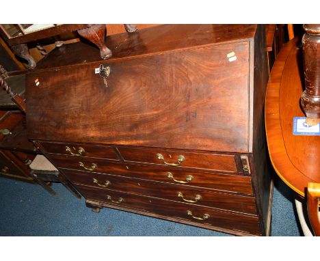 A GEORGIAN MAHOGANY FALL FRONT BUREAU, the interior revealing various satinwood front drawers and a beize interior, above two