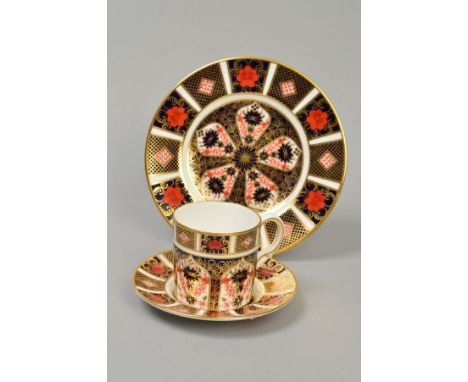 A ROYAL CROWN DERBY OLD IMARI COFFEE CAN AND SAUCER '1128' pattern, together with matching side plate, diameter 16cm (3)