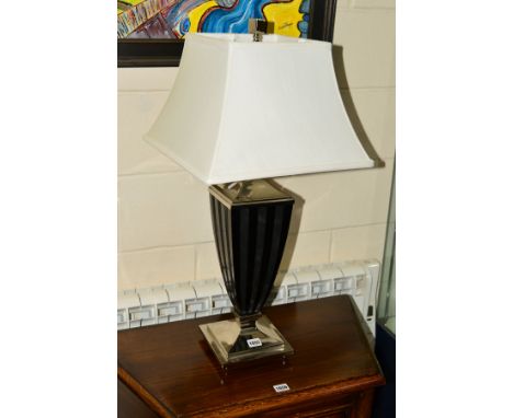 A CONTEMPORARY CHROME FRAMED TABLE LAMP by Uttermost Lighting with a square white shade, height 76cm