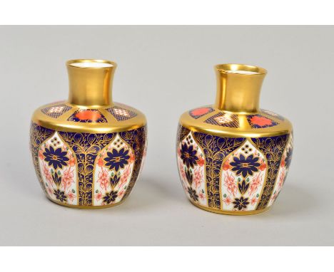 A PAIR OF ROYAL CROWN DERBY OLD IMARI VASES, solid gold band '1128' pattern, approximate height 10.5cm (one seconds) (2)