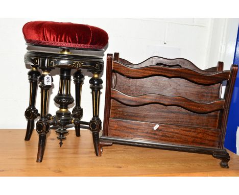 AN AESTHETIC MOVEMENT EBONISED AND GILT INLAID SWIVEL TOP PIANO STOOL, together with a mahogany magazine rack (2)