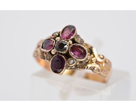 A MID VICTORIAN GOLD AMETHYST AND SPLIT PEARL RING, designed as four oval amethysts in a flower shape interspaced by collet s