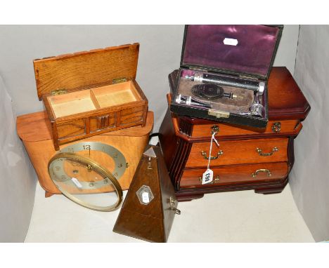 A MINIATURE TABLE TOP JEWELLERY BOX SHAPED AS A CHEST OF DRAWERS, height 25cm x width 29cm, a Maelzel metronome, a Smith's ma