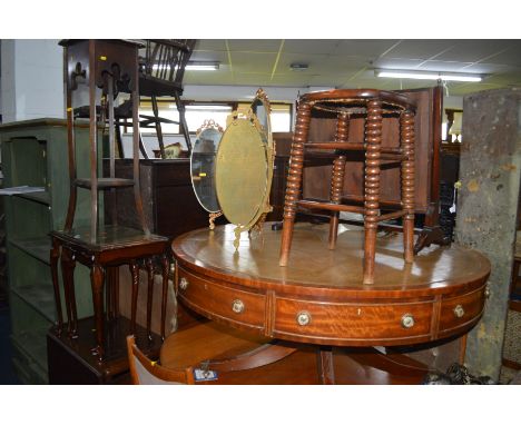 AN EARLY 20TH CENTURY OAK BOBBIN TURNED CANE SEATED STOOL, a mahogany nest of three tables, an oak drop leaf tea trolley, gil