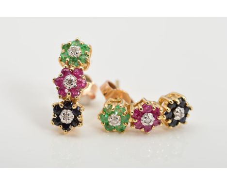 A PAIR OF 9CT GOLD MULTI-GEM EARRINGS, designed as a vertical row of three flower heads, an emerald, a ruby and a sapphire fl