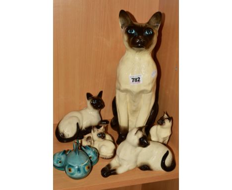 FIVE ROYAL DOULTON SIAMESE CATS to include fireside model DA83 (seconds), height 35cm, Kittens DA122, lying (style two) DA124