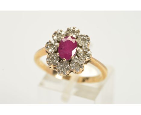 A MODERN 9CT GOLD RUBY AND DIAMOND OVAL CLUSTER RING, estimated total diamond weight 0.25ct, ring size P, approximate gross w