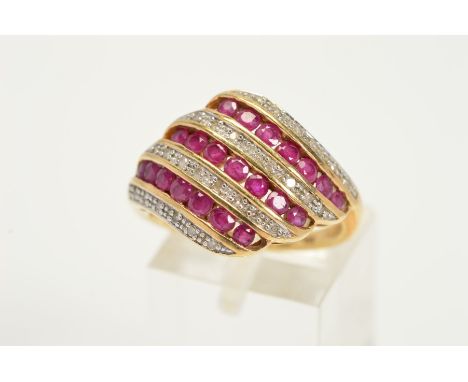 A MODERN RUBY AND DIAMOND DRESS RING, comprised rubies and diamonds grain and channel set, ring size P, hallmarked 9ct gold S