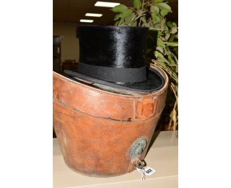 A BLACK TOP HAT MADE IN LONDON FOR CARSWELL OF GLASGOW, approximate size 52cm, good condition, together with a brown leather 