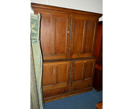 A LATE VICTORIAN SCUMBLED PINE PANELLED FOUR DOOR HOUSEKEEPERS CUPBOARD, turquoise painted interior, the top section revealin