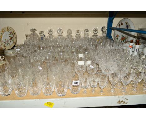 A LARGE QUANTITY OF CUT GLASS ETC, to include nine decanters, Stuart Crystal drinking glasses, French Crystal drinking glasse