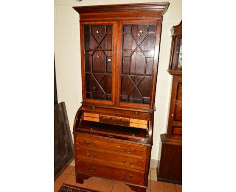 AN EDWARDIAN MAHOGANY, EBONY STRUNG AND SATINWOOD BANDED BARREL FRONT BUREAU/BOOKCASE, overhanging cornice, the top with doub