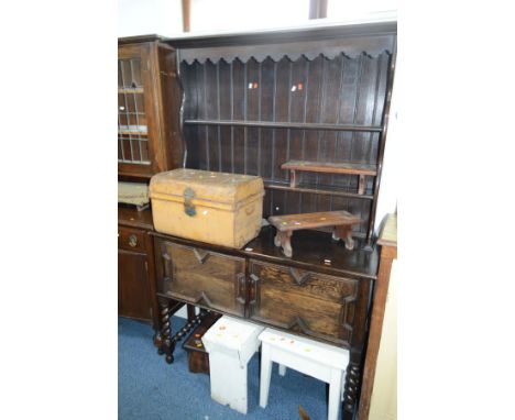 AN OAK BARLEY TWIST DRESSER, with double geometric panelled doors, width 121cm x depth 46cm x height 172cm and a tin trunk (2