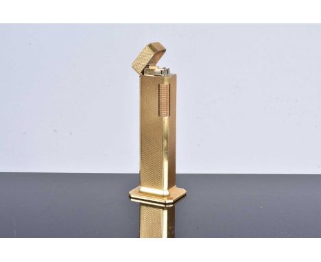 A gold plated Dunhill Tallboy Table lighter, with engine turned design to the body, no overseas postal shipment for this lot 