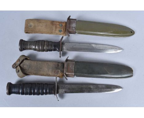 A WWII US M3 Combat knife by Case, marked to the cross guard,  leather washer grip handle, oval metal pommel, complete with a