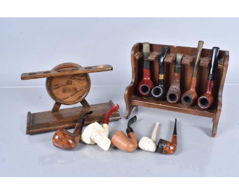 An assortment of smoking pipes,  to include a Carey Magic Inch, a My Friend, a Medico Tuxedo, an Italian Compact, a Reject, a